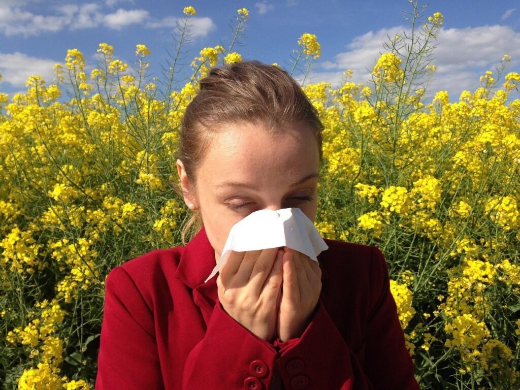 sneezing woman with allergy